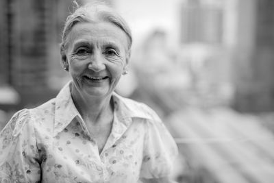 Portrait of smiling senior woman outdoors