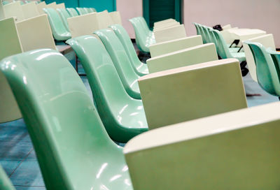 High angle view of empty chairs on table