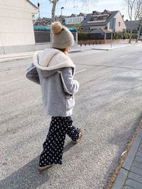 Girl walking on road