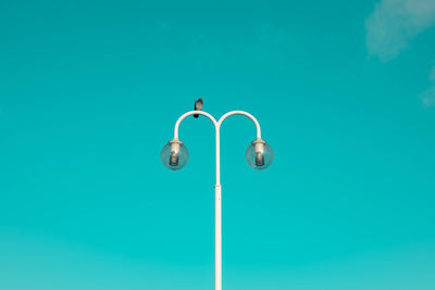 Close-up of lamp against blue background