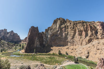 Scenic view of mountains against clear blue sky