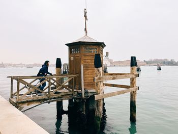 Pier over sea against clear sky