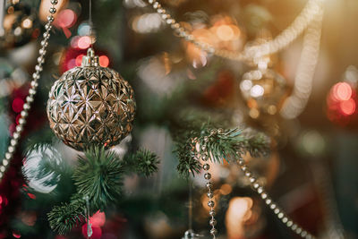 Close-up of christmas decoration hanging on tree