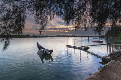 Scenic view of lake against sky during sunset