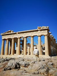 Exterior of temple against clear blue sky