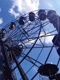 Low angle view of ferris wheel against sky