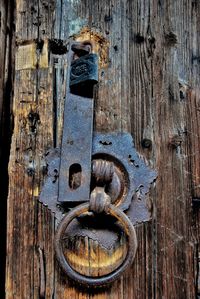Close-up of old rusty door knocker