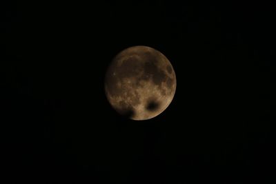 Low angle view of moon against sky at night
