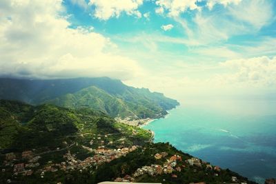 Scenic view of mountains against cloudy sky