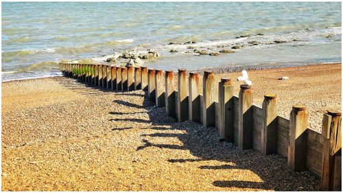 High angle view of groyne on beach