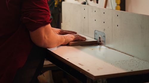 Midsection of man working in office