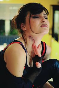 Close-up of young woman with vampire wound