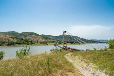 View of suspension bridge in water