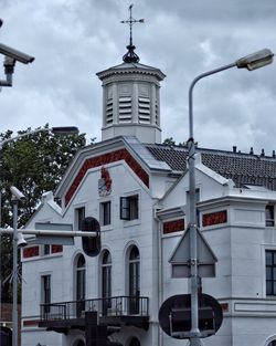 Low angle view of bell tower against sky