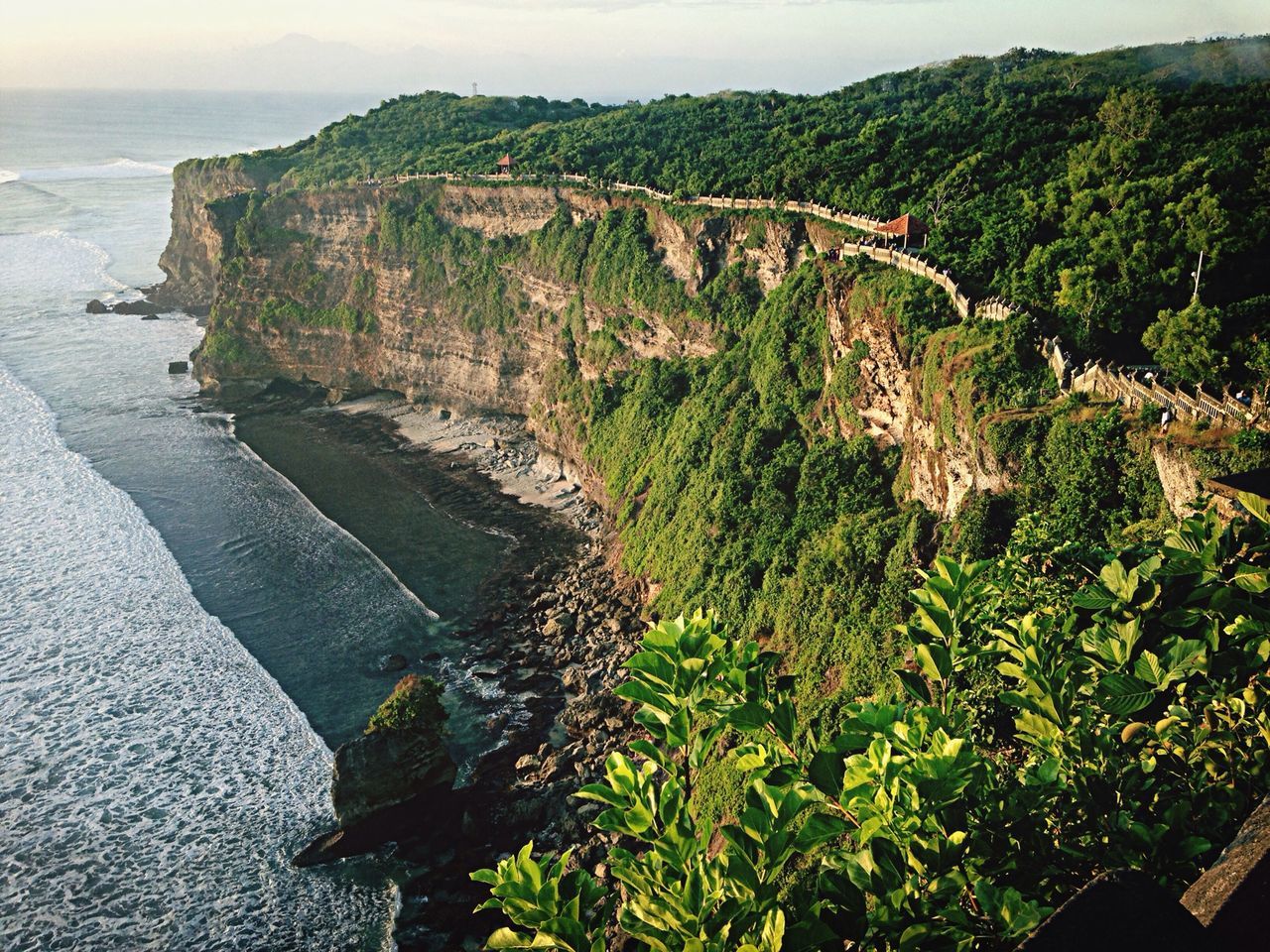 water, sea, tranquility, tranquil scene, scenics, nature, beauty in nature, mountain, beach, rock formation, high angle view, rock - object, coastline, cliff, sky, shore, horizon over water, plant, day, idyllic