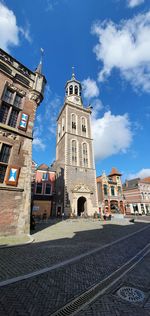 Low angle view of old tower against sky