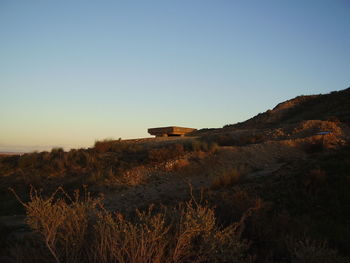 Scenic view of field against clear blue sky