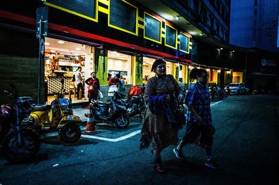 People on street at night