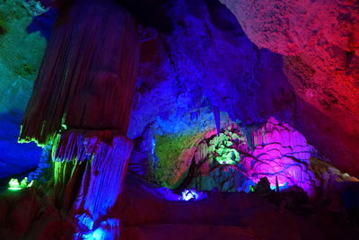 Low angle view of rock formations at night