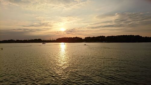 Scenic view of sea against sky at sunset