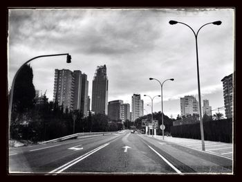 City street against cloudy sky