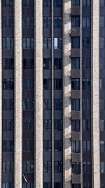 Full frame shot of building in city, moder architecture exterior design, windows and balconies 