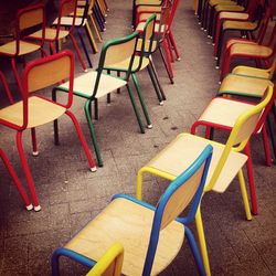 Row of multi colored empty chairs