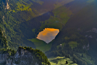 Scenic view of mountains against sky at sunset