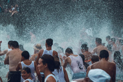 People enjoying in swimming pool