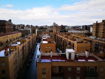 High angle view of buildings in city against sky