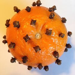 Close-up of pumpkin against orange background