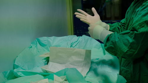 Close-up of human hand holding paper