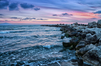 Scenic view of sea against cloudy sky