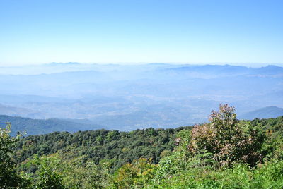 Scenic view of mountains against clear blue sky