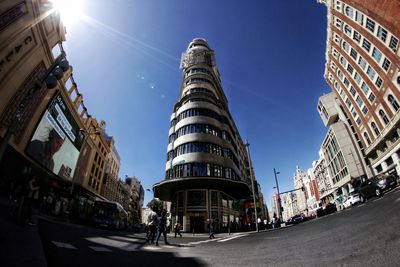 Low angle view of buildings against sky in city