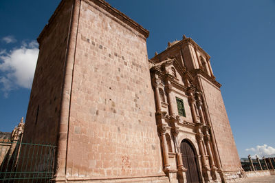 Low angle view of bell tower against sky