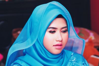 Close-up of bride in traditional clothing looking away