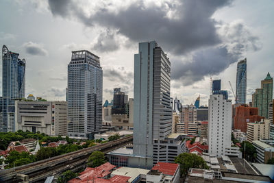 Bangkok, thailand - 12 august 2022 - view of bangkok cityscape high-rises and bts skytrains