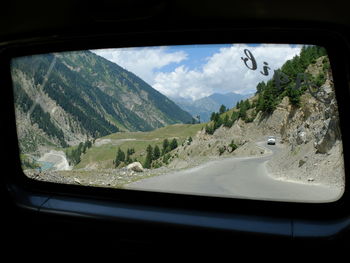 Road seen through car windshield