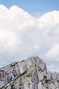 Low angle view of rock formation against sky