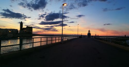 View of sea against cloudy sky during sunset