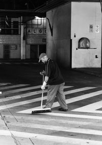 Full length of man skateboarding in bus