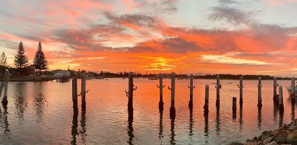 Scenic view of lake against sky during sunset