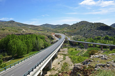 Scenic view of mountain road against sky