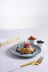 High angle view of fruits in plate on table