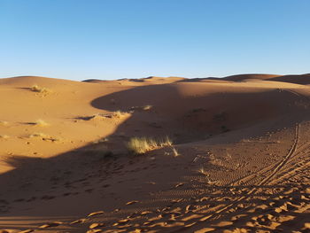 Scenic view of desert against clear sky