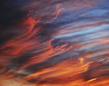 Low angle view of cloudy sky at sunset