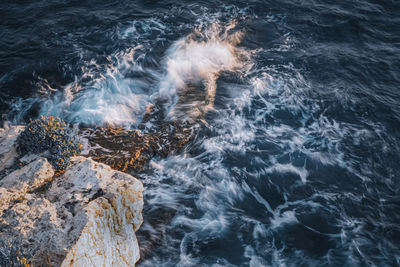 High angle view of rock formation in sea