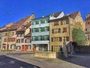 View of buildings against blue sky