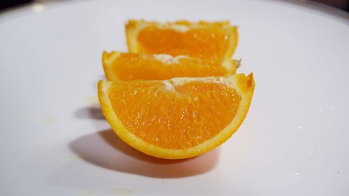 Close-up of orange slice in plate